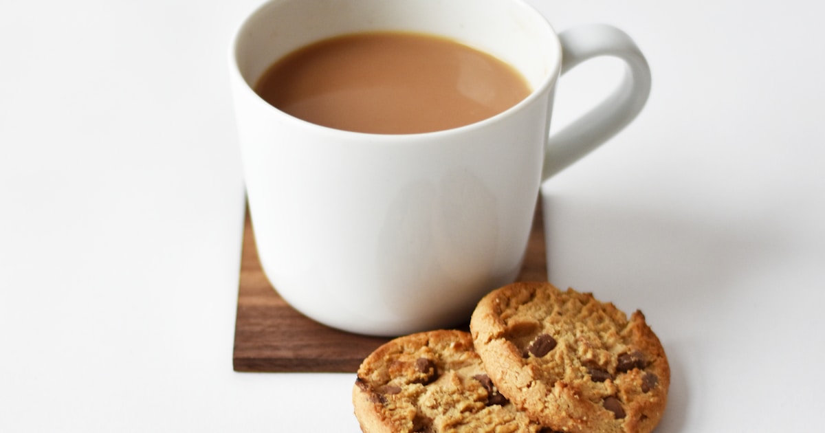 herbal teas for anxiety relief - cup of chamomile tea with dried herbs